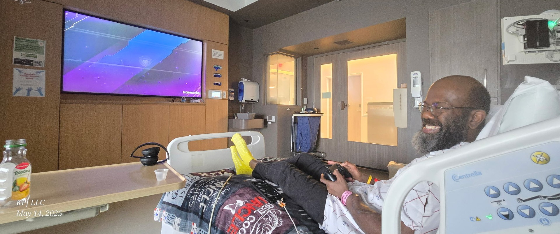 Andrew Boyd sitting in hospital bed