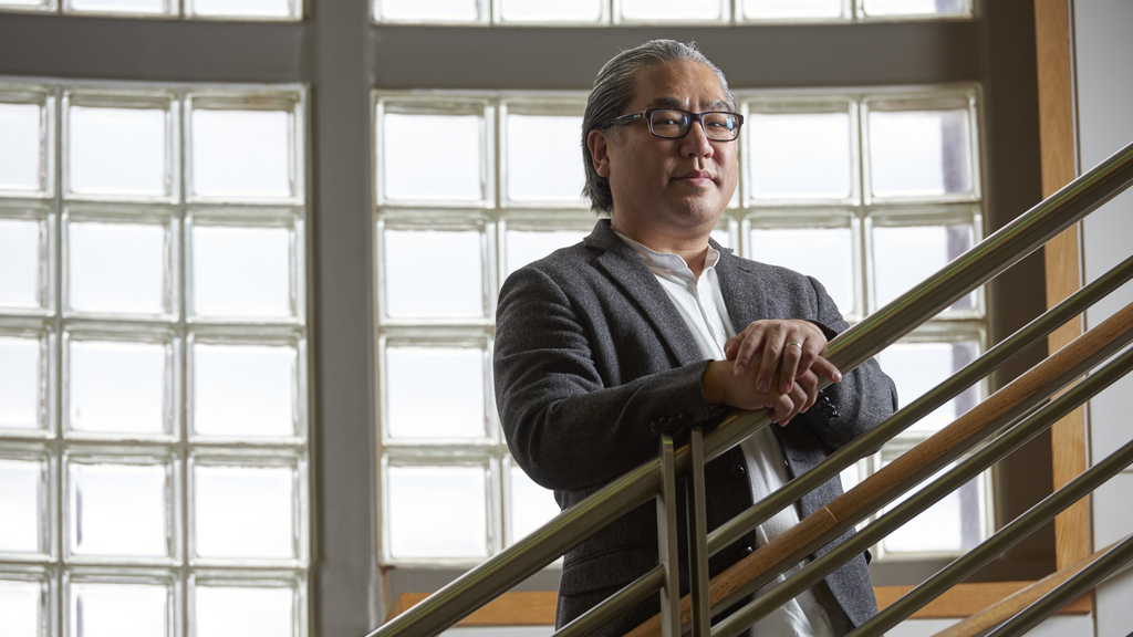 Portrait of Edward Lee standing on a staircase