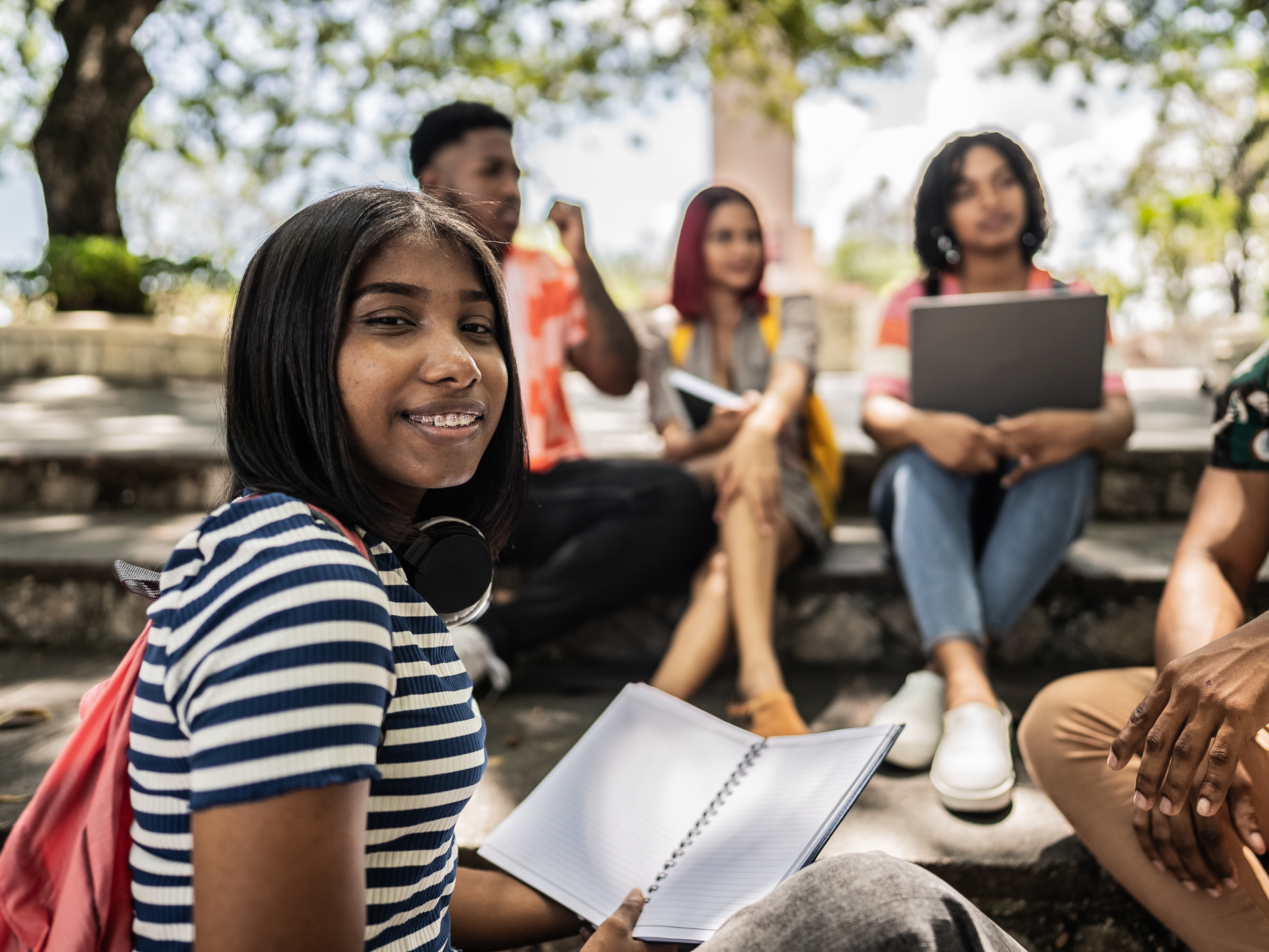 Portrait of a university student young woman at university campus outdoors