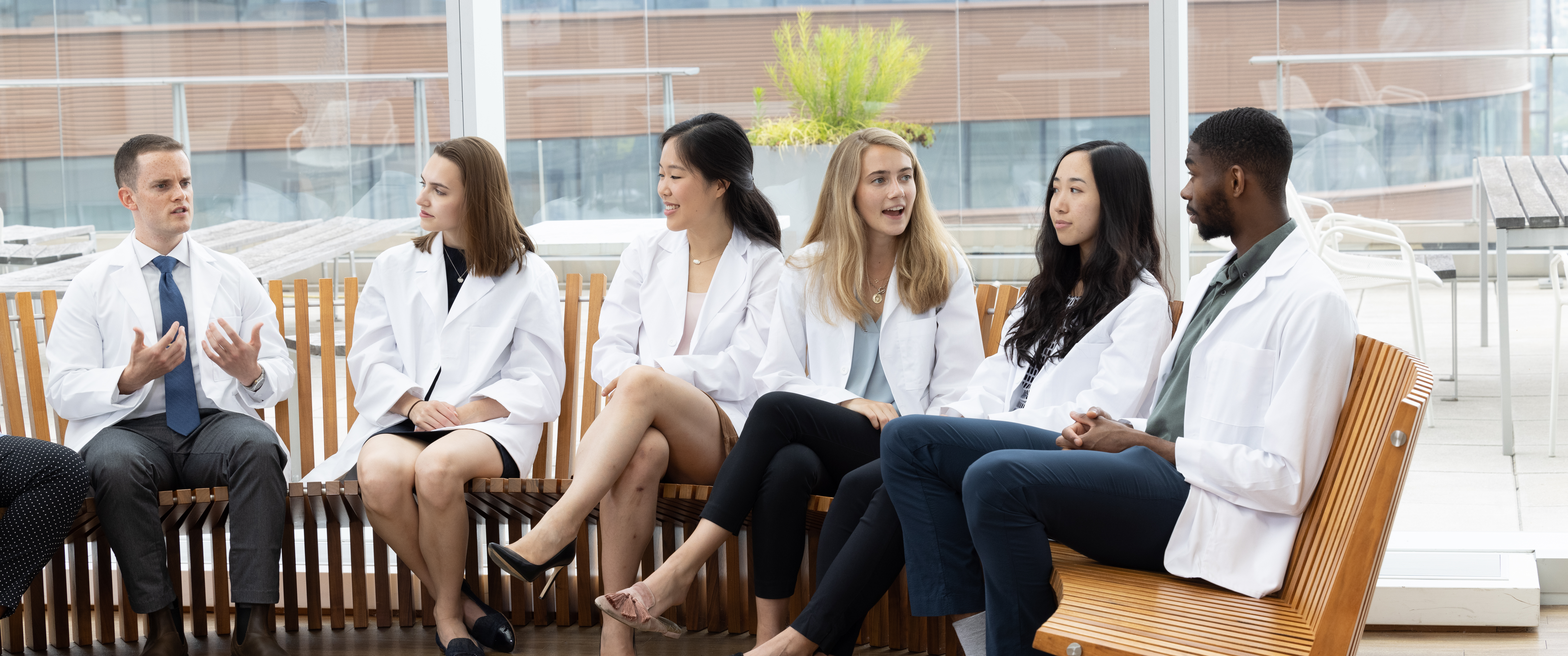 Medical students at the Perelman School of Medicine having discussion on bench