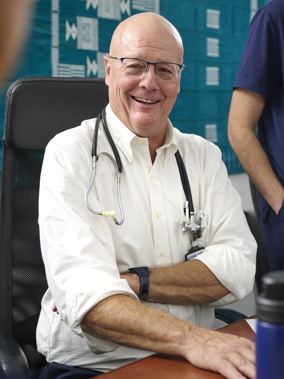 Michael Beers, MD, smiling at the African Health Clinic