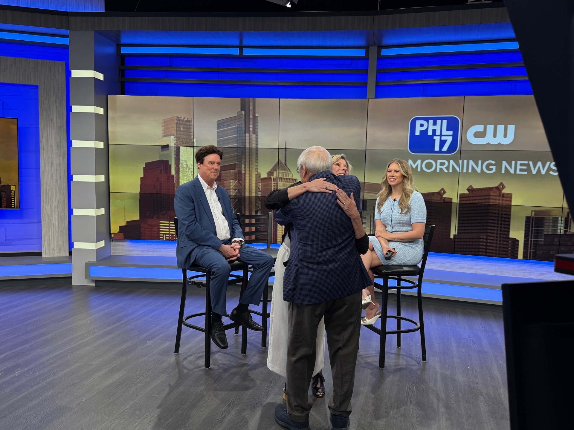 Meredith Williams on phl17 set hugging her brother