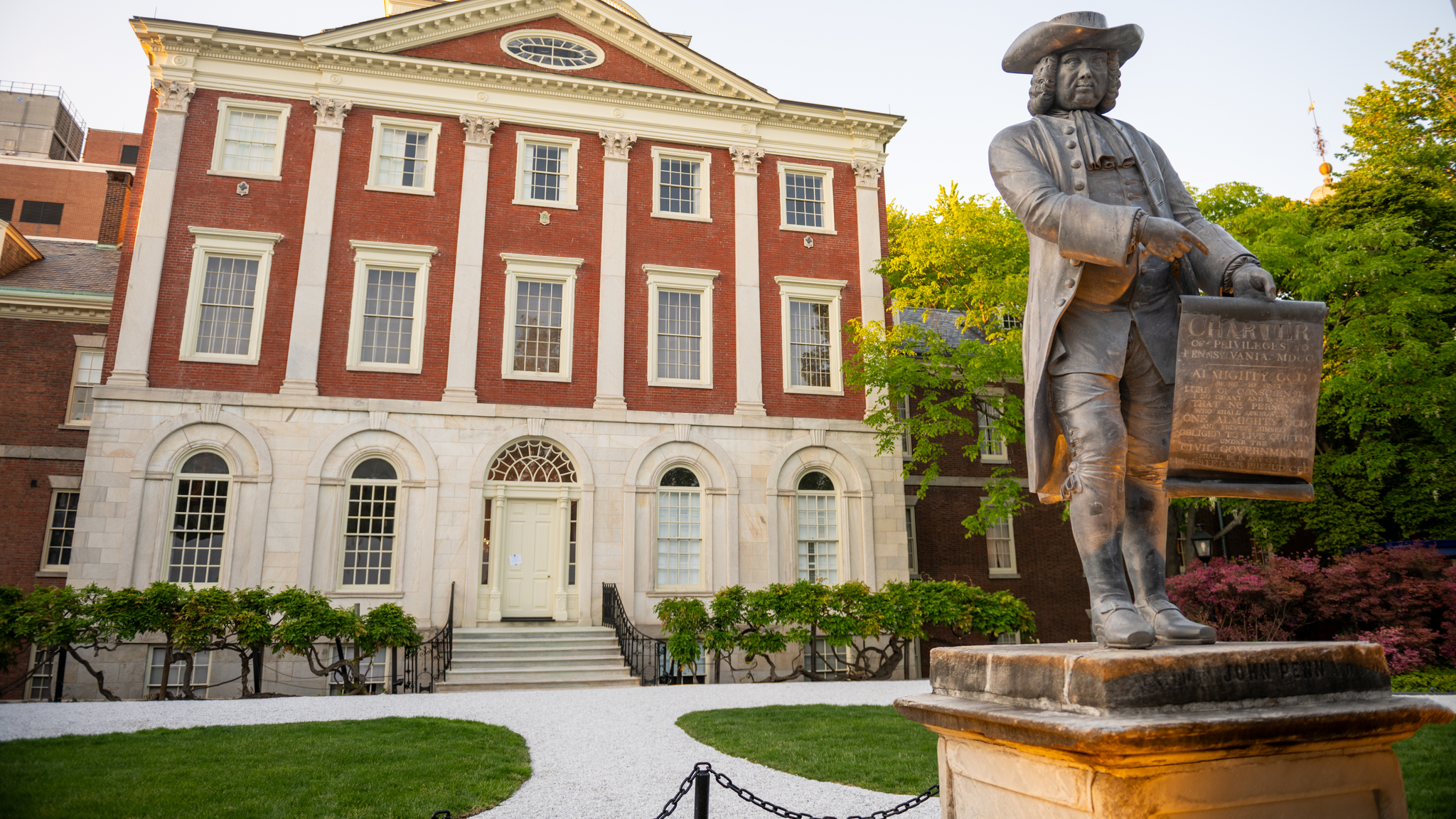 Exterior of Pennsylvania Hospital Pine Building with a statue of William Penn