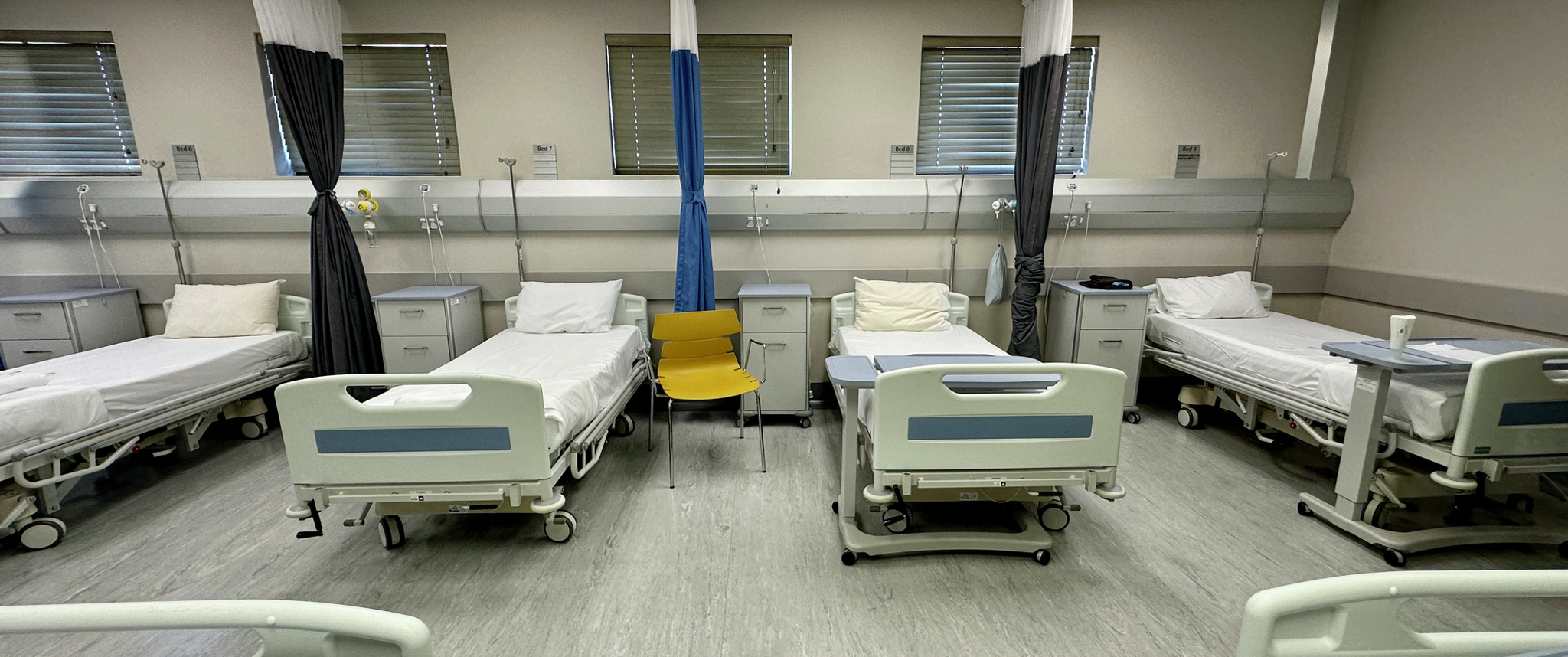 Beds in empty hospital ward