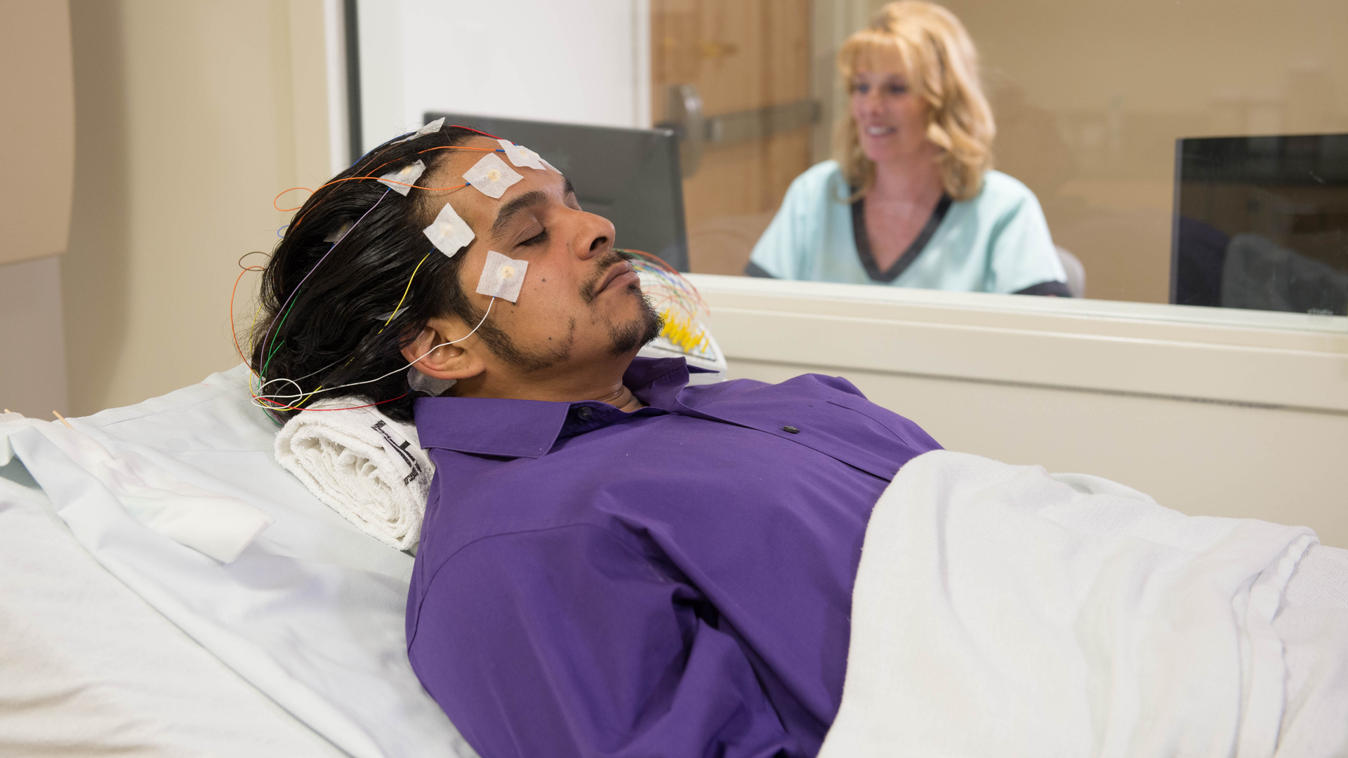 Epilepsy patient being monitored by nurse