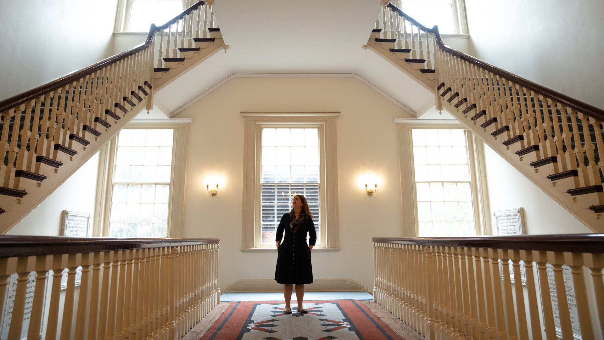  Stacey Peeples standing in the Pennsylvania Hospital Great Court stairway on second level