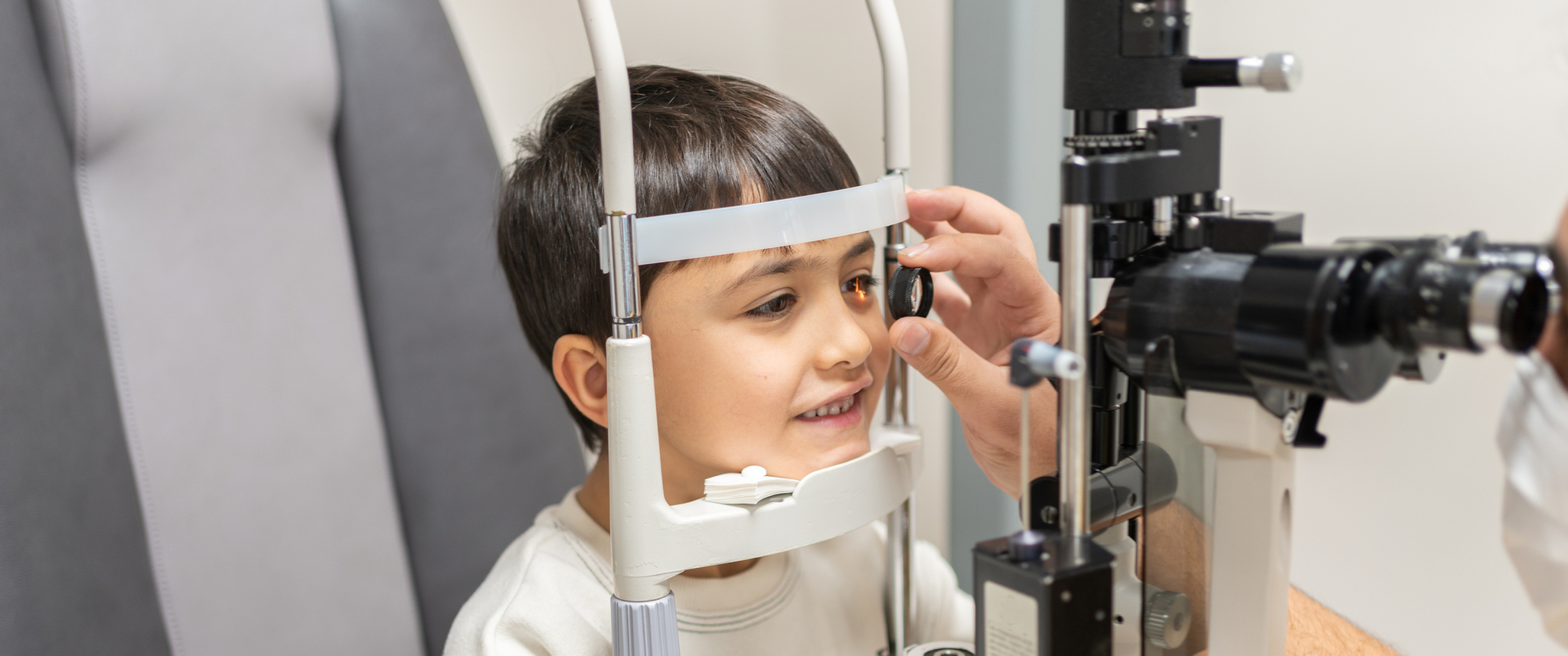 Schoolchilds Eye Vision İs Checked. Eye Test And Close Lamp Examination Are Performed