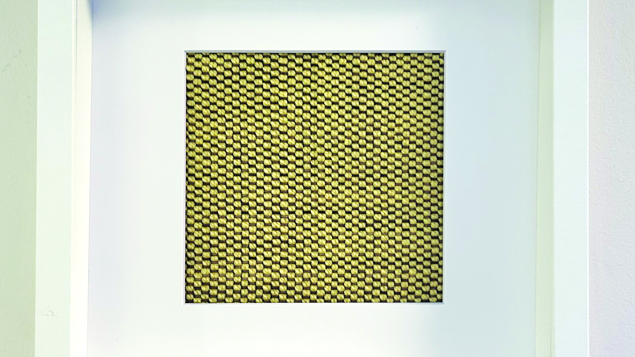 Woven artwork in a frame  as part of Linda Ruggiero’s Mom Series 