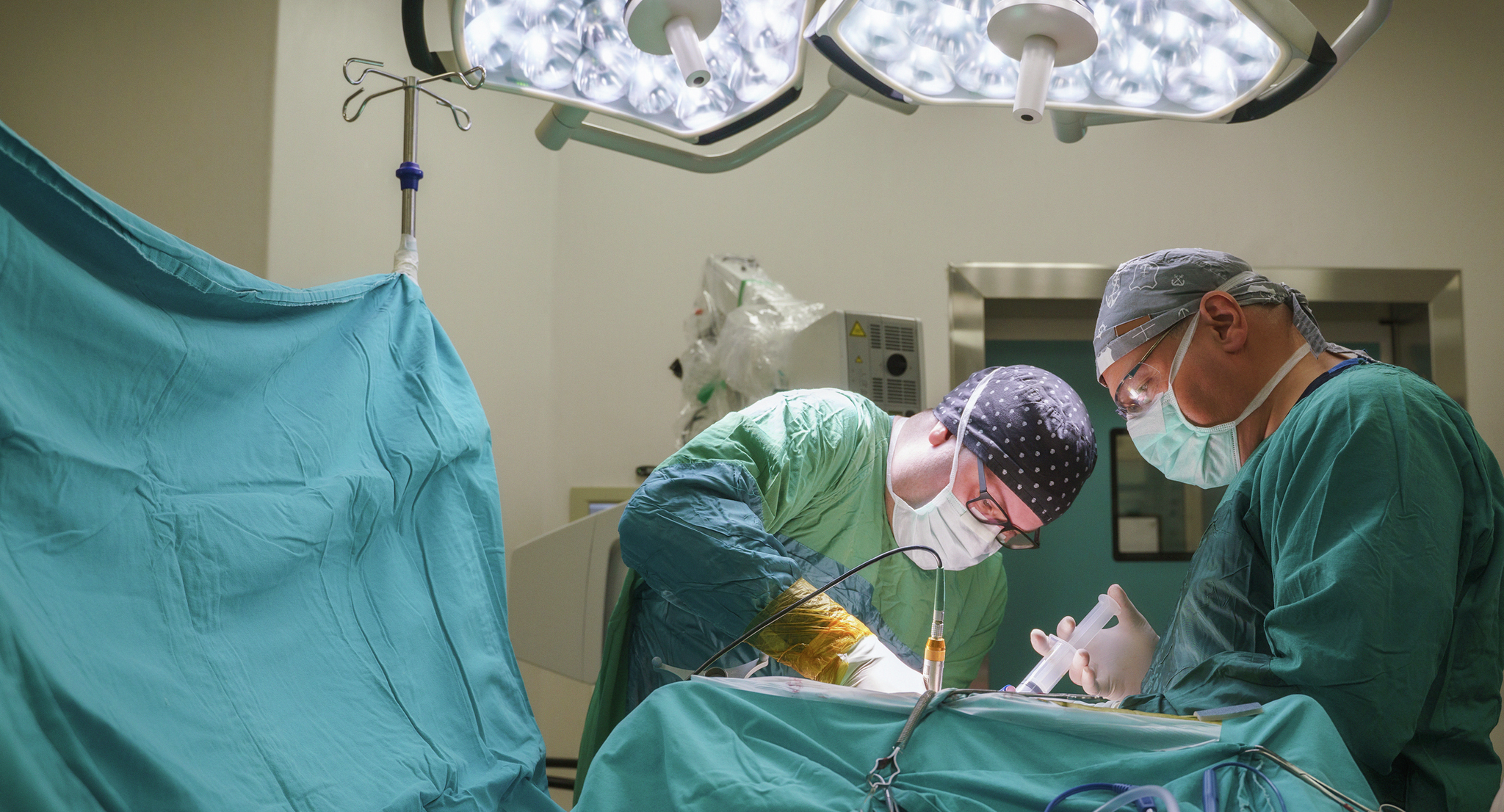 Neurosurgeon team operating brain tumor surgery in hospital operating room