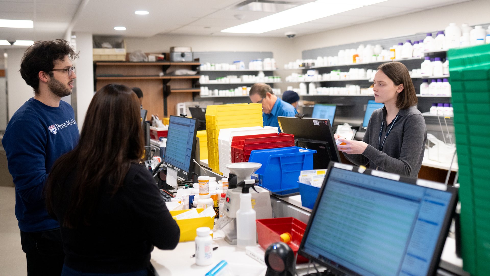 Pharmacists filling prescriptions in the retail pharmacy at Penn Presbyterian Medical Center
