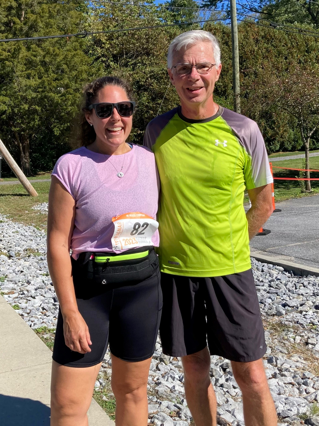 Abbey Oatman and Fred Kohler, smiling together, wearing running gear