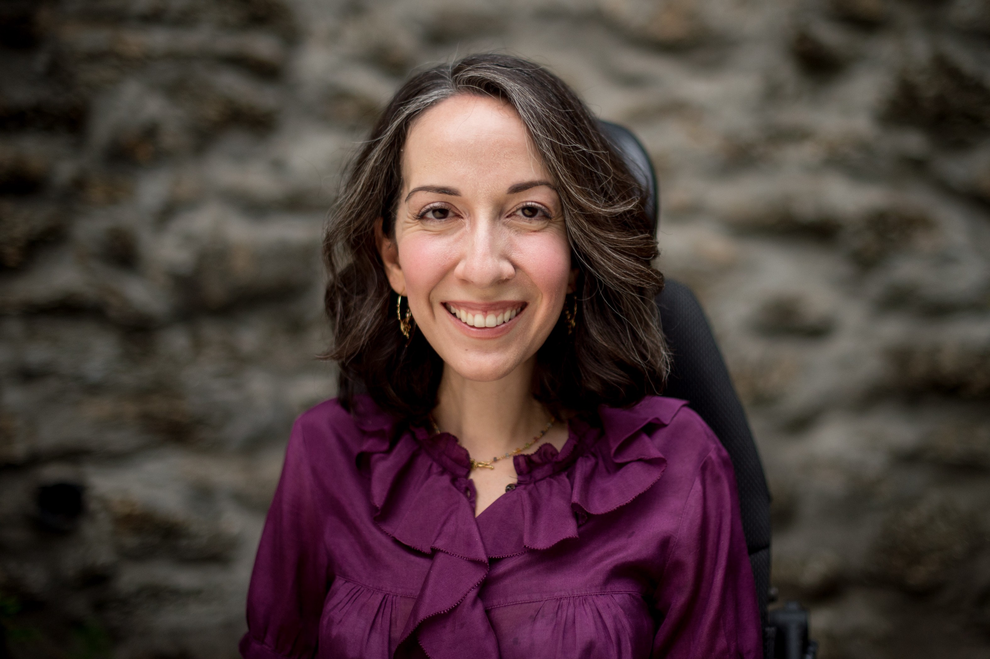 Portrait of Viola Dwyer smiling, a woman with dark brown hair