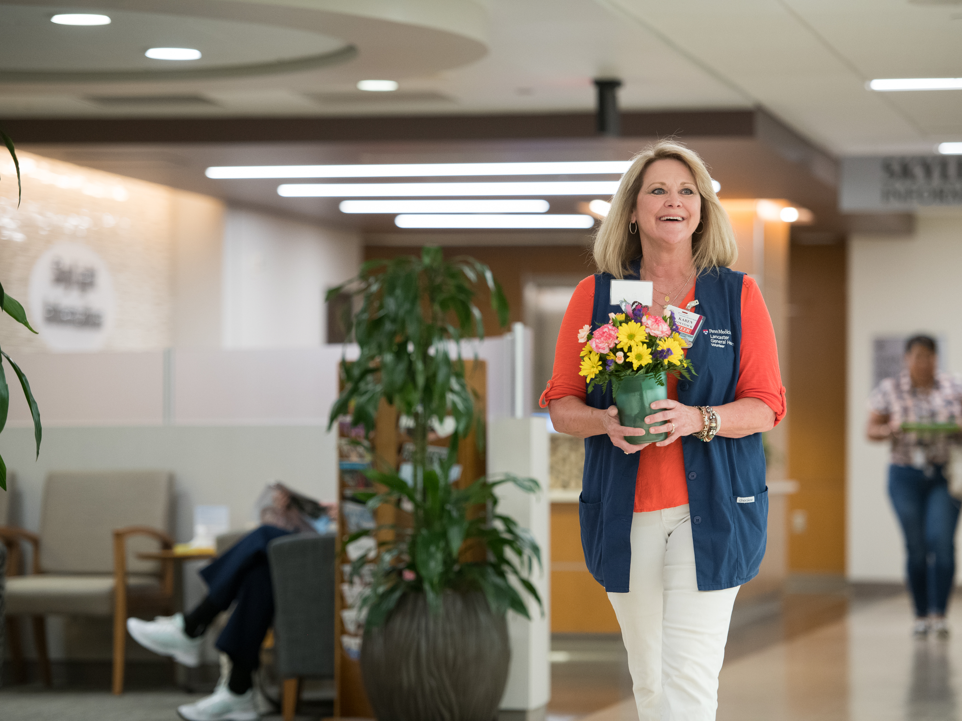 Lancaster General Hospital volunteer, Karen Voystick, delivers flowers to patient