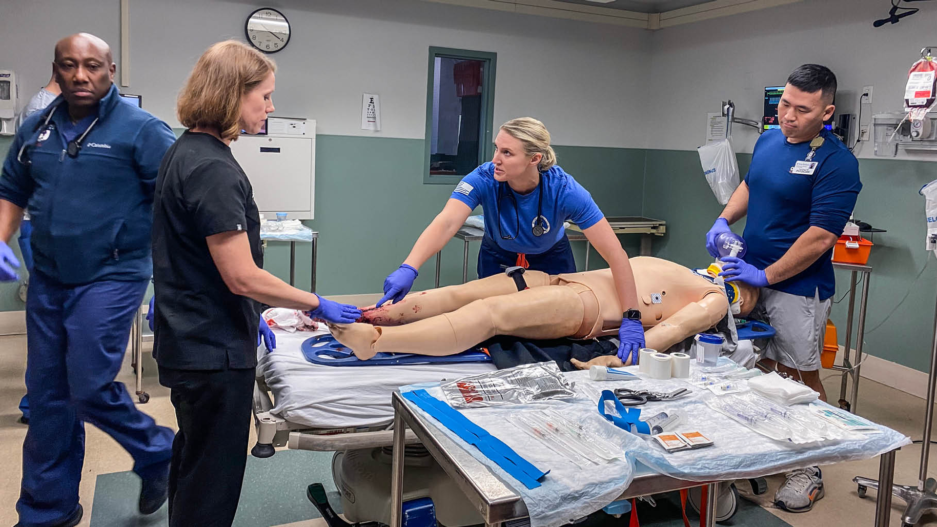 Clinicians from the Penn Trauma team, including Navy team members, train together in a simulation exercise