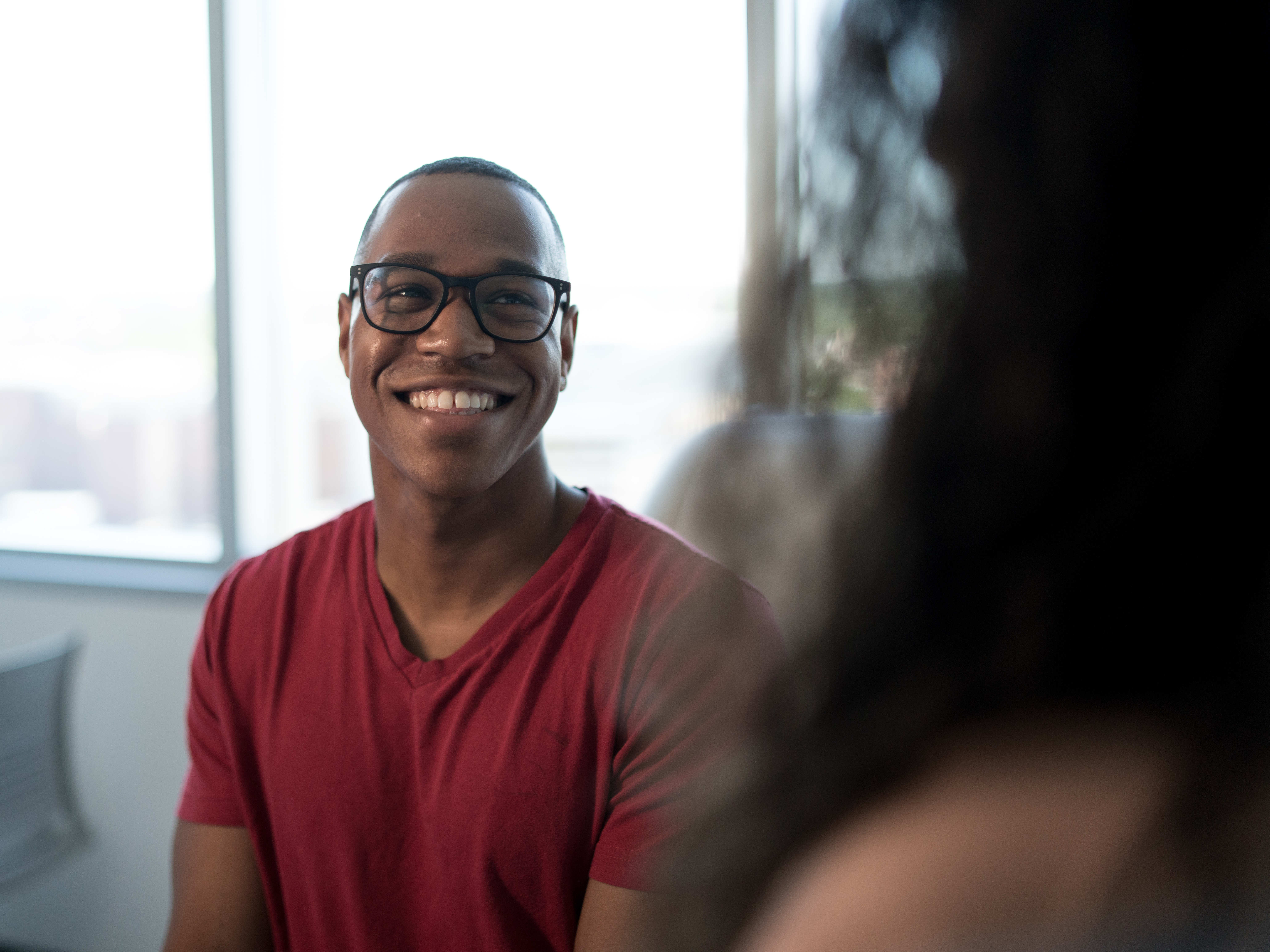 Primary care patient smiling at doctor
