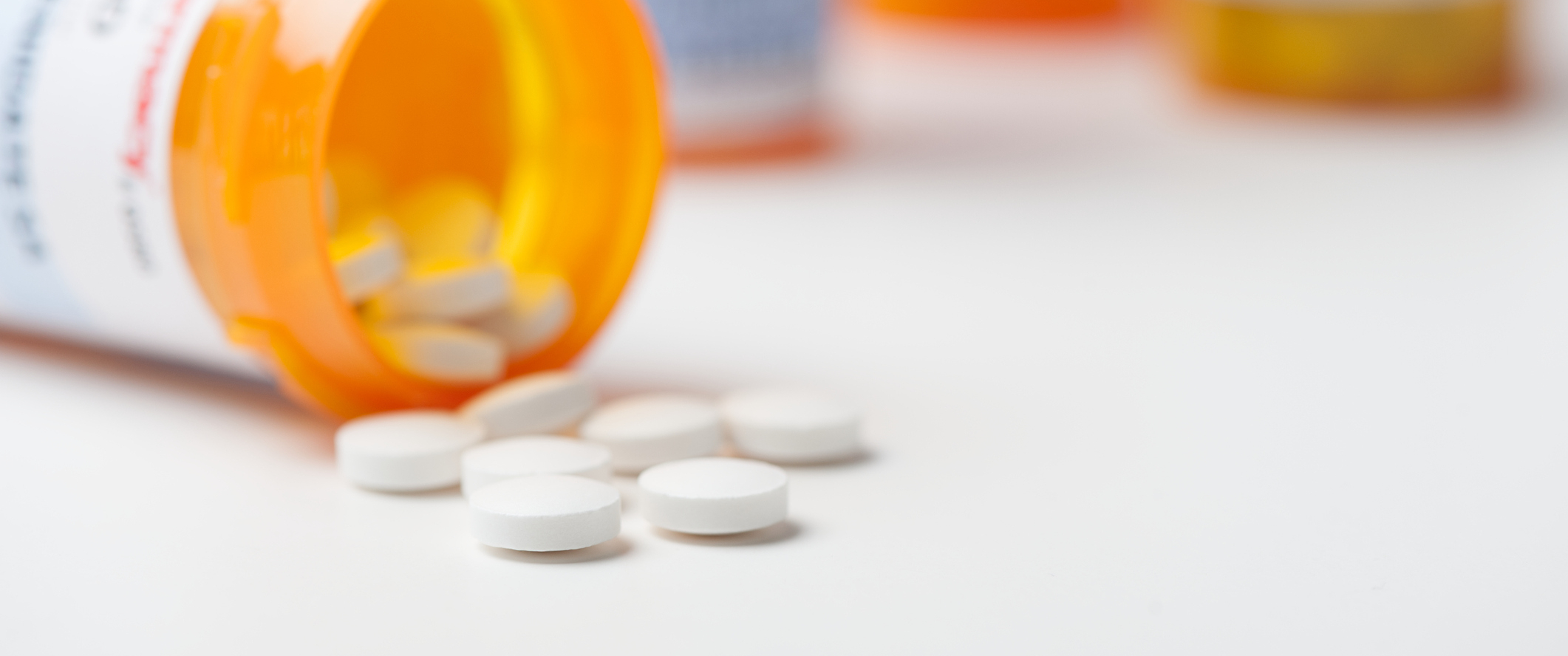 A prescription bottle with pills