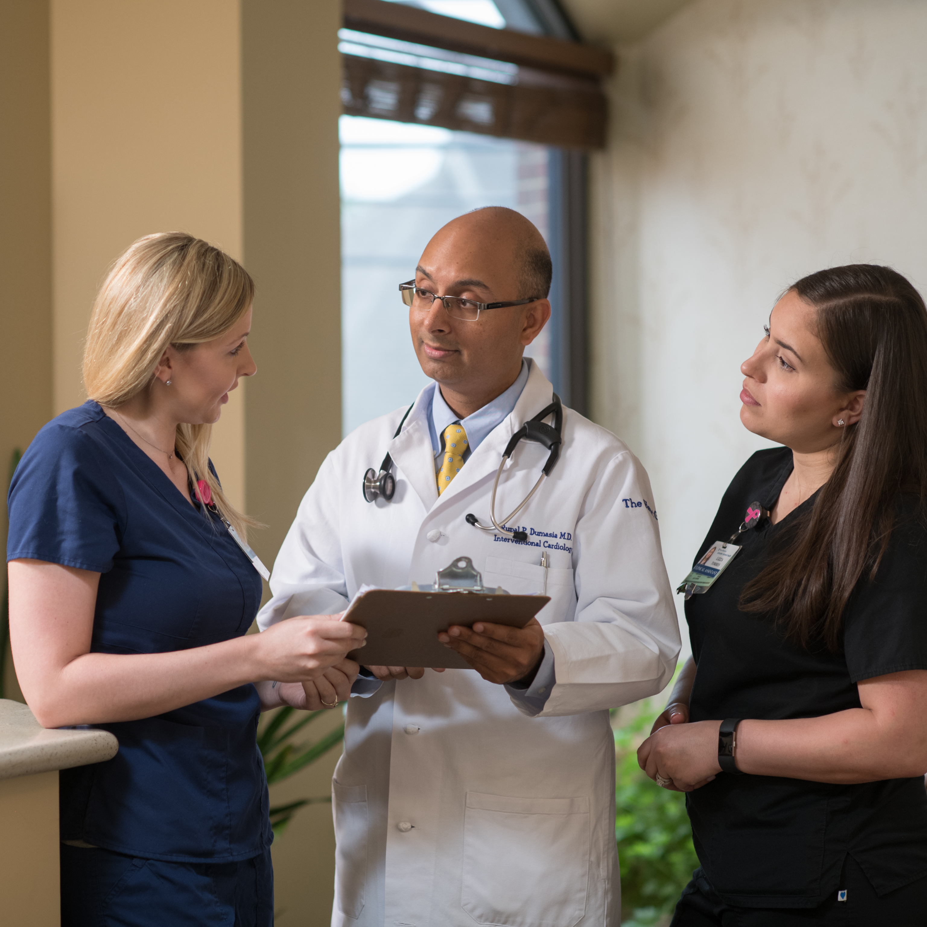 Dr. Rupal Dumasia meets with nurses Alissa Kaufhold and Lizza Torres at the Penn Medicine Heart Group office in Lancaster