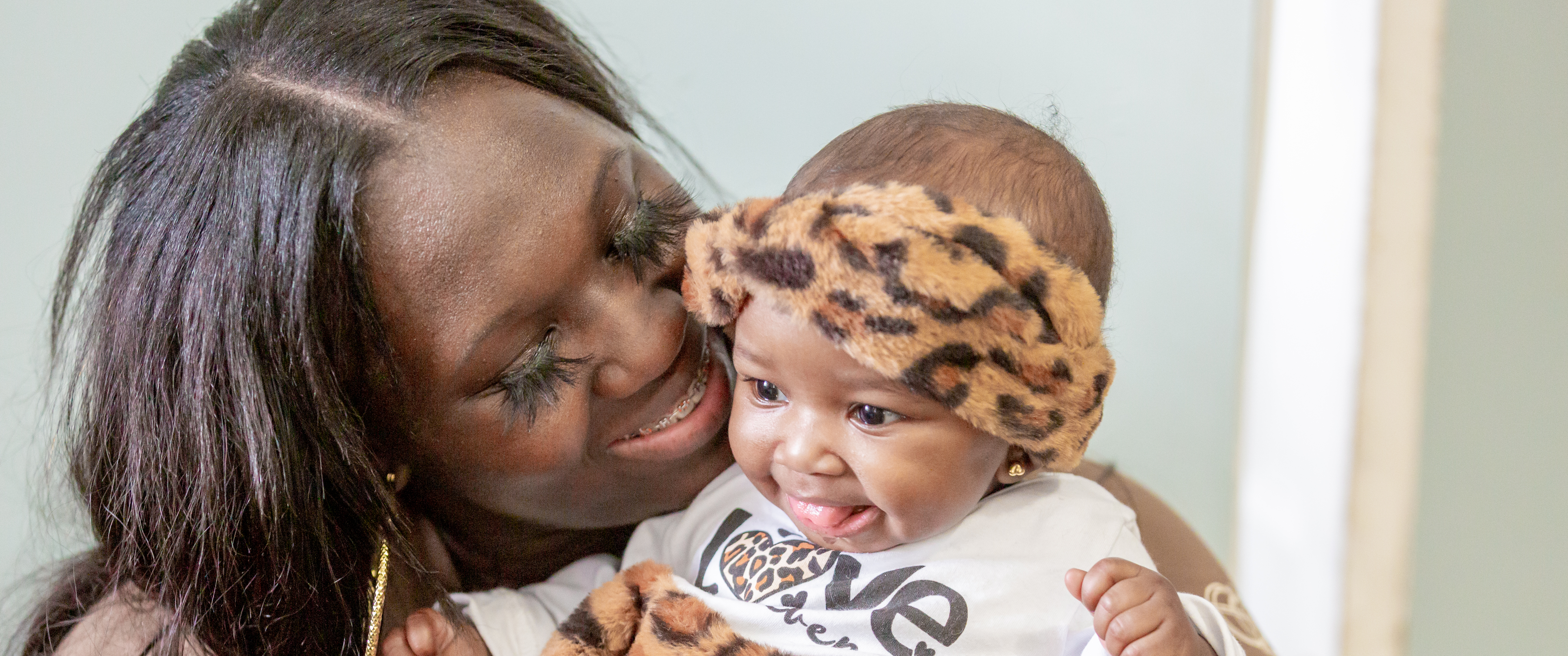 Talicia Williams cuddles her 6-month-old baby girl
