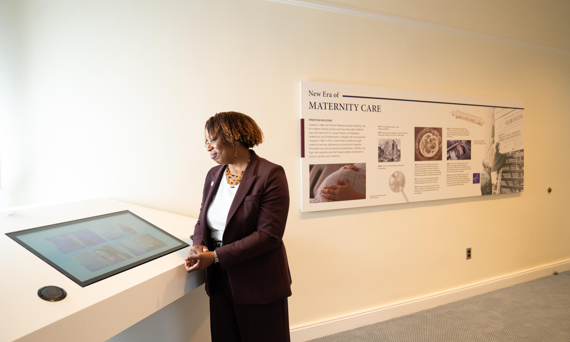 Alicia Gresham looking at a video screen in the Women's Health gallery of the Pennsylvania Hospital museum
