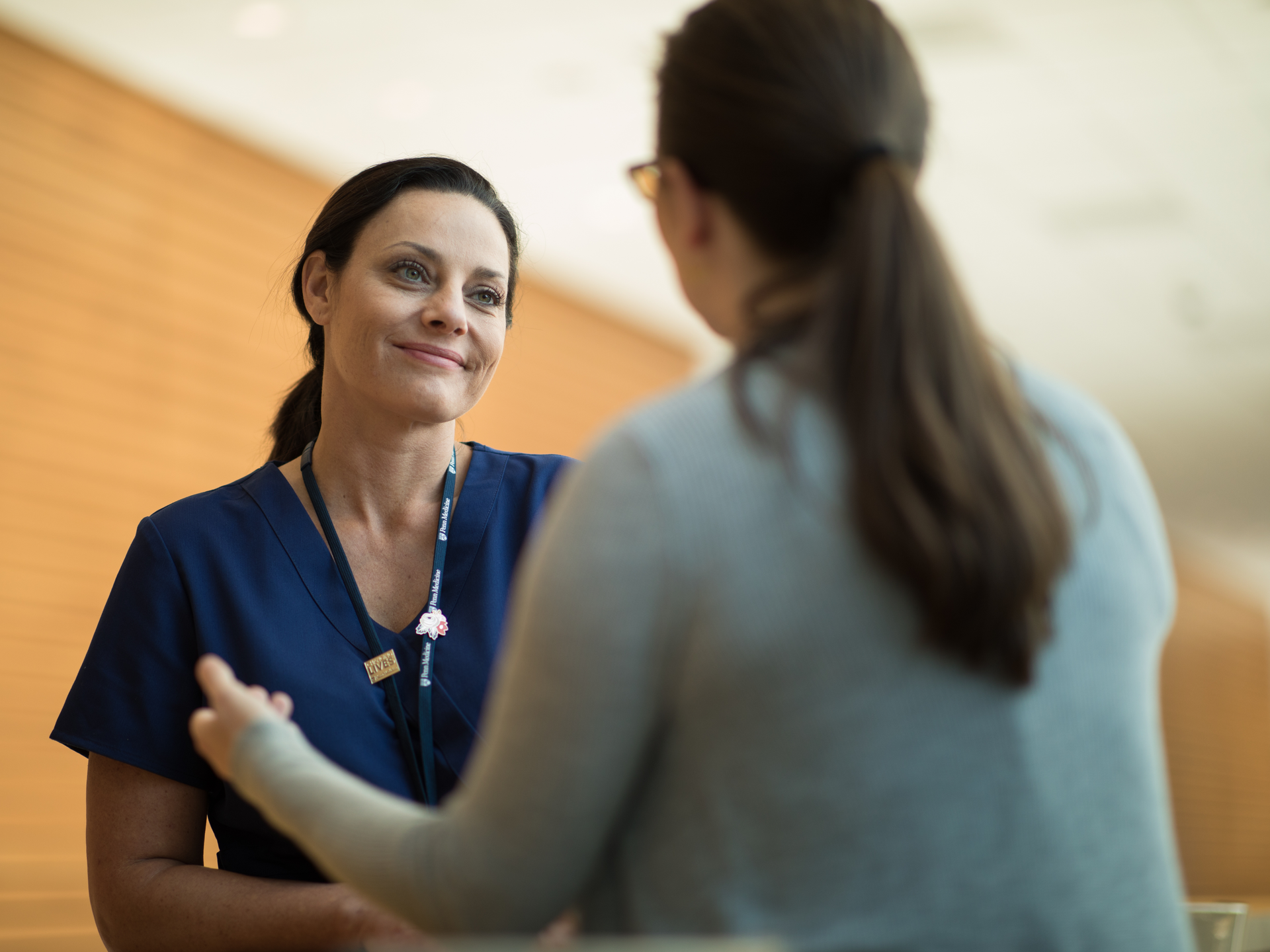 Women's health nurse with patient