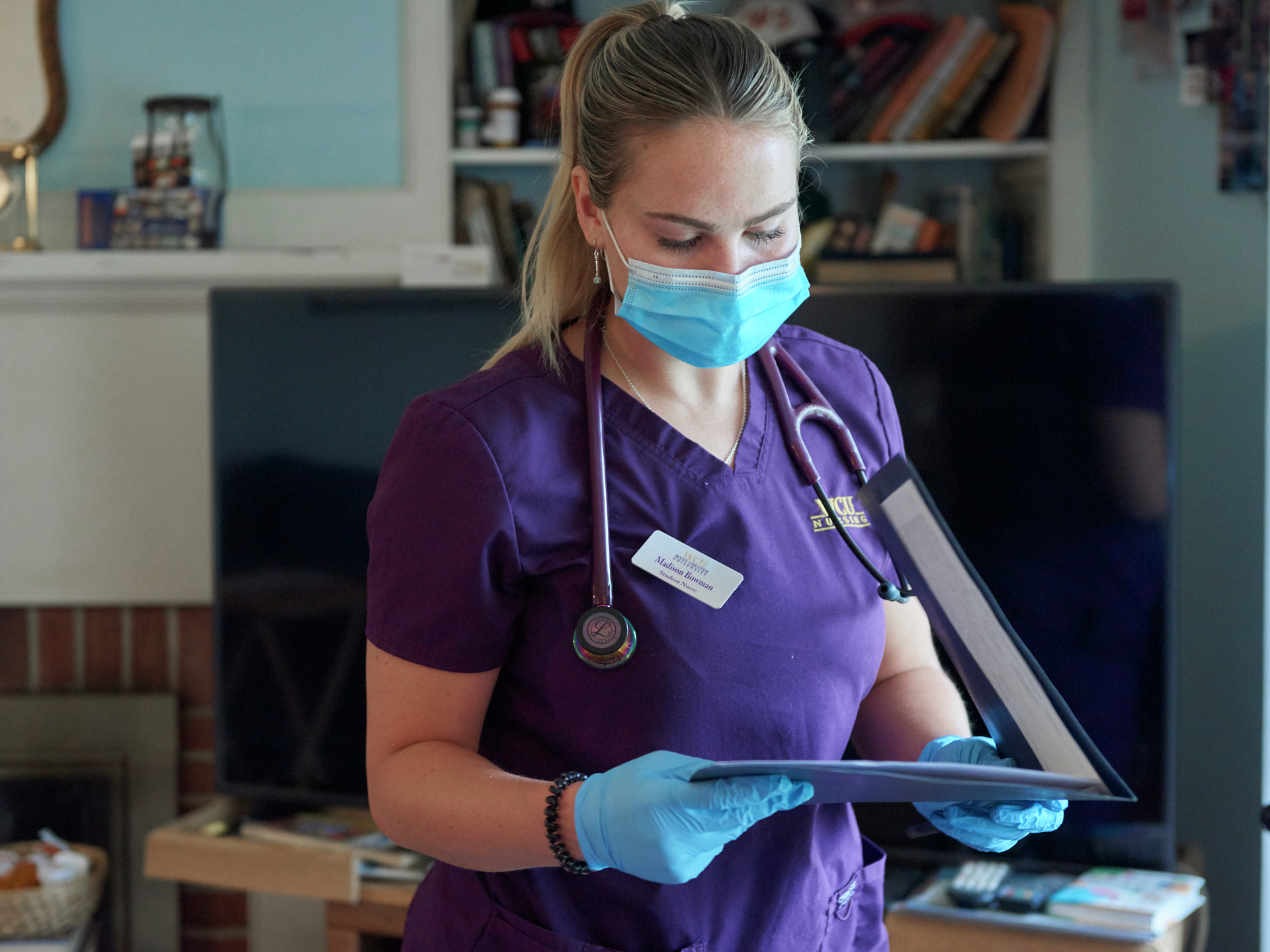 Student nurse Melissa Bowman looks at a folder