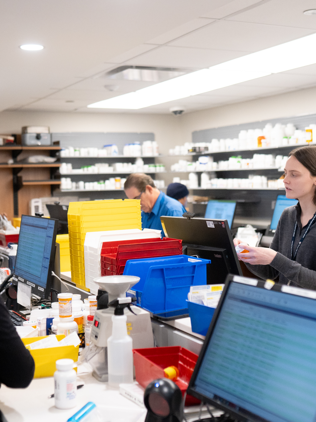 Pharmacists filling prescriptions in the retail pharmacy at Penn Presbyterian Medical Center