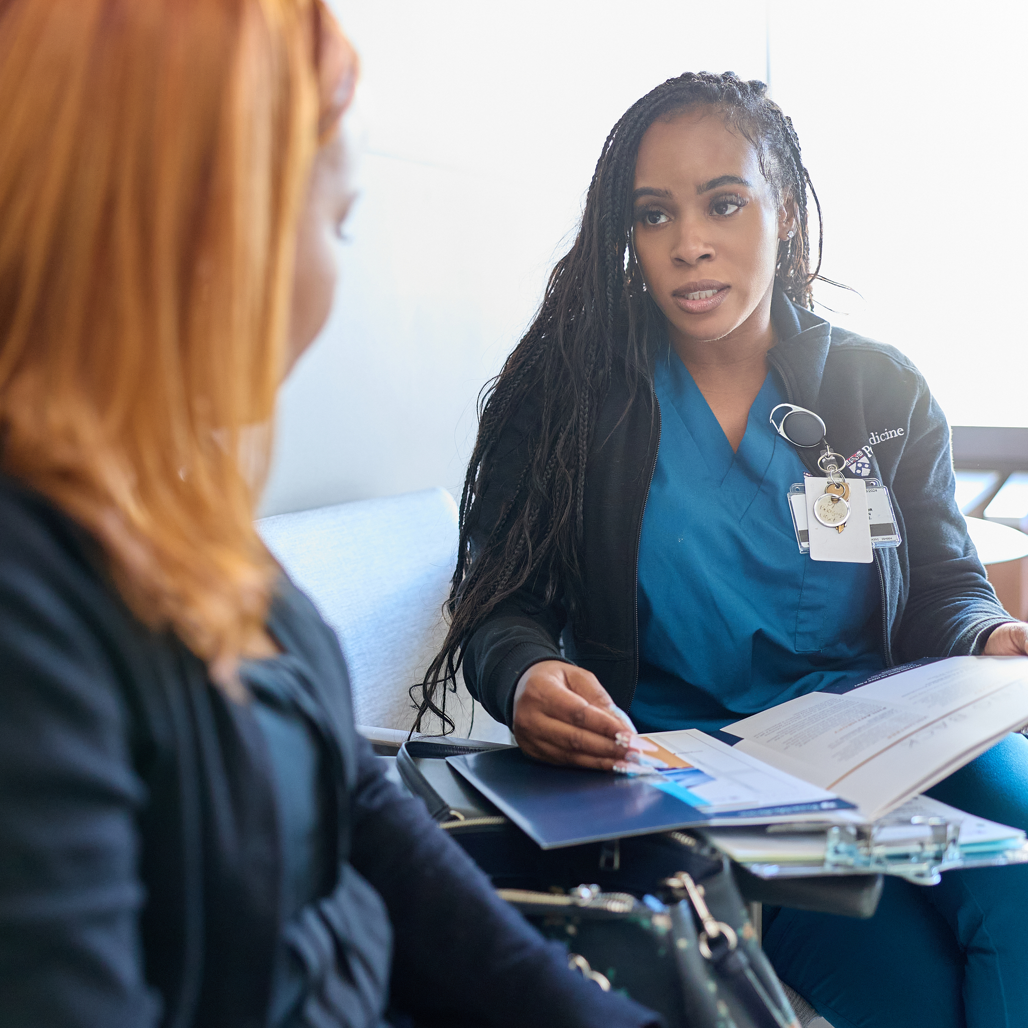 Penn Medicine nurse discussing cerebrovascular treatments with a patient