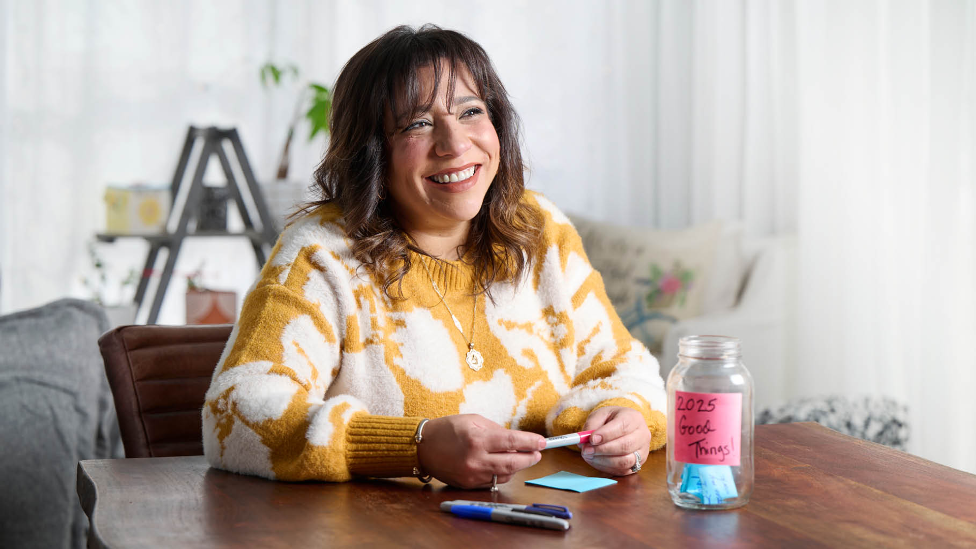 Illeana Casiano-Vazquez, smiling and relaxed at home 
