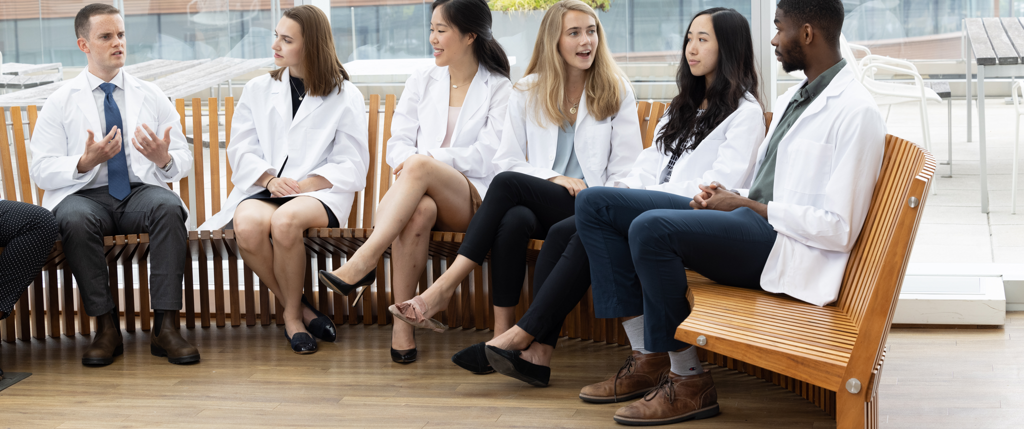 Medical students at the Perelman School of Medicine having discussion on bench