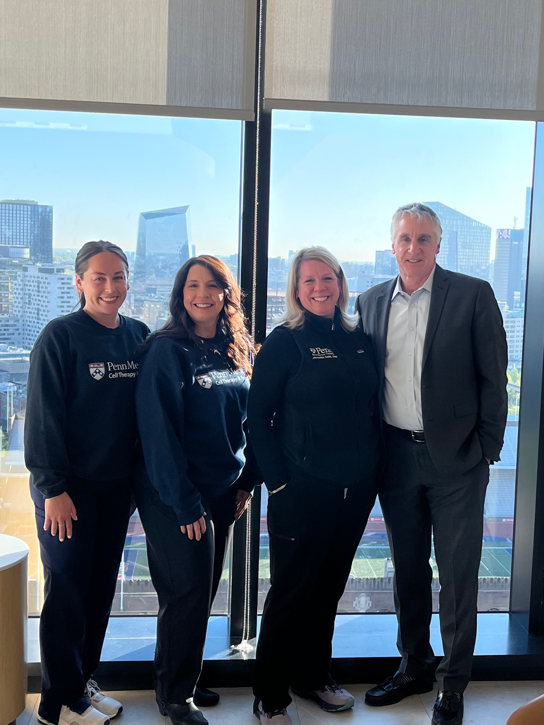 From left: Rachel Smith, Kim Hummel, and Jackie Smith, with David Porter, MD, Penn Medicine’s director of Cell Therapy and Transplant