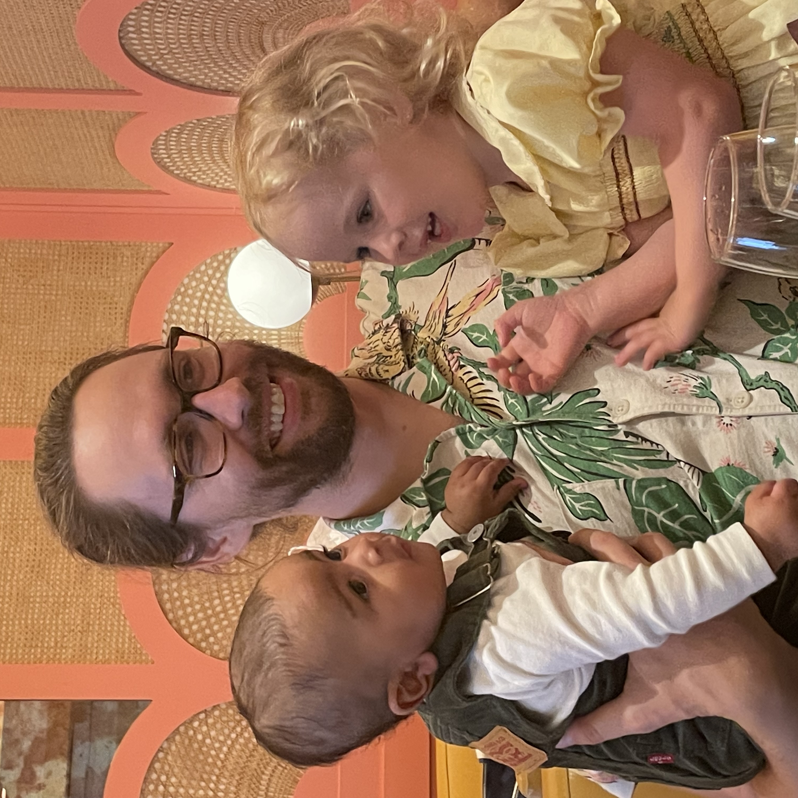A dad with baby boy Rome and Ella, a little girl whose mother donated the uterus that carried Rome