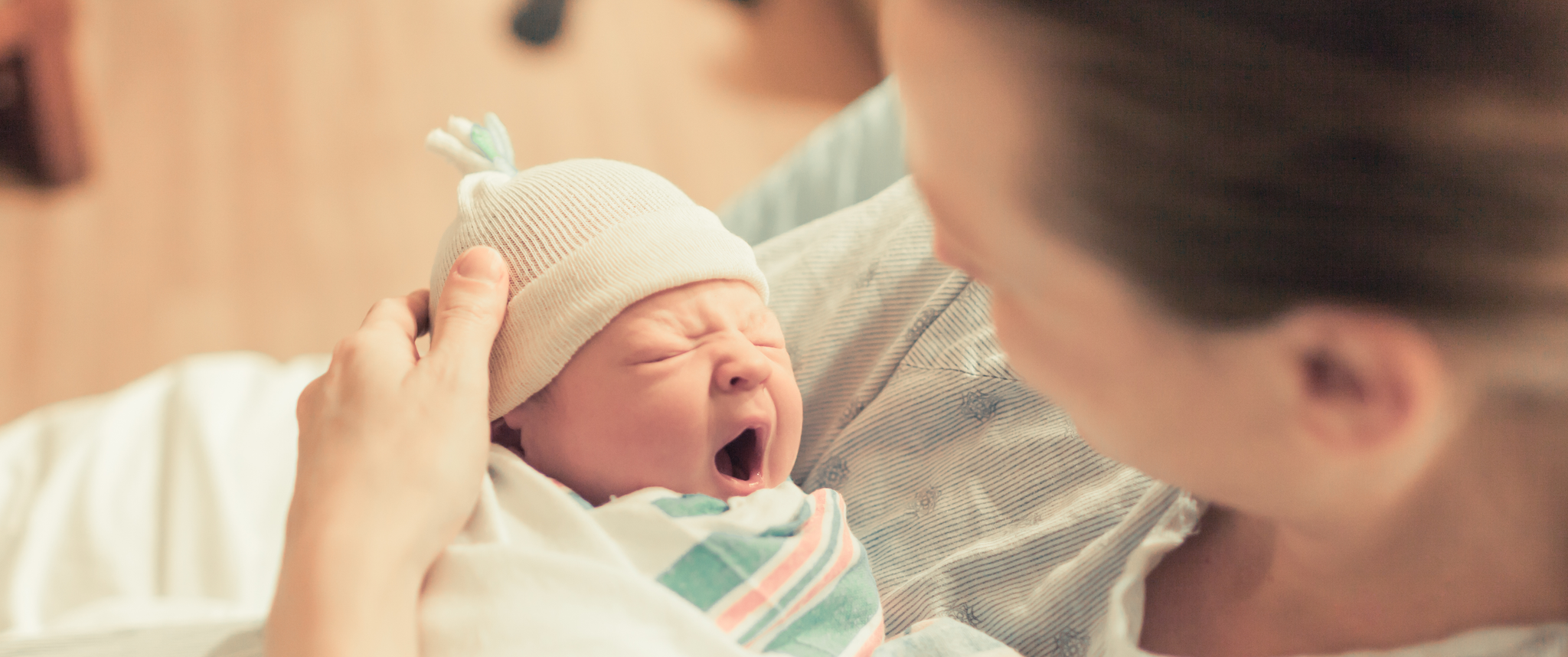 Mother in hospital holding her new born baby