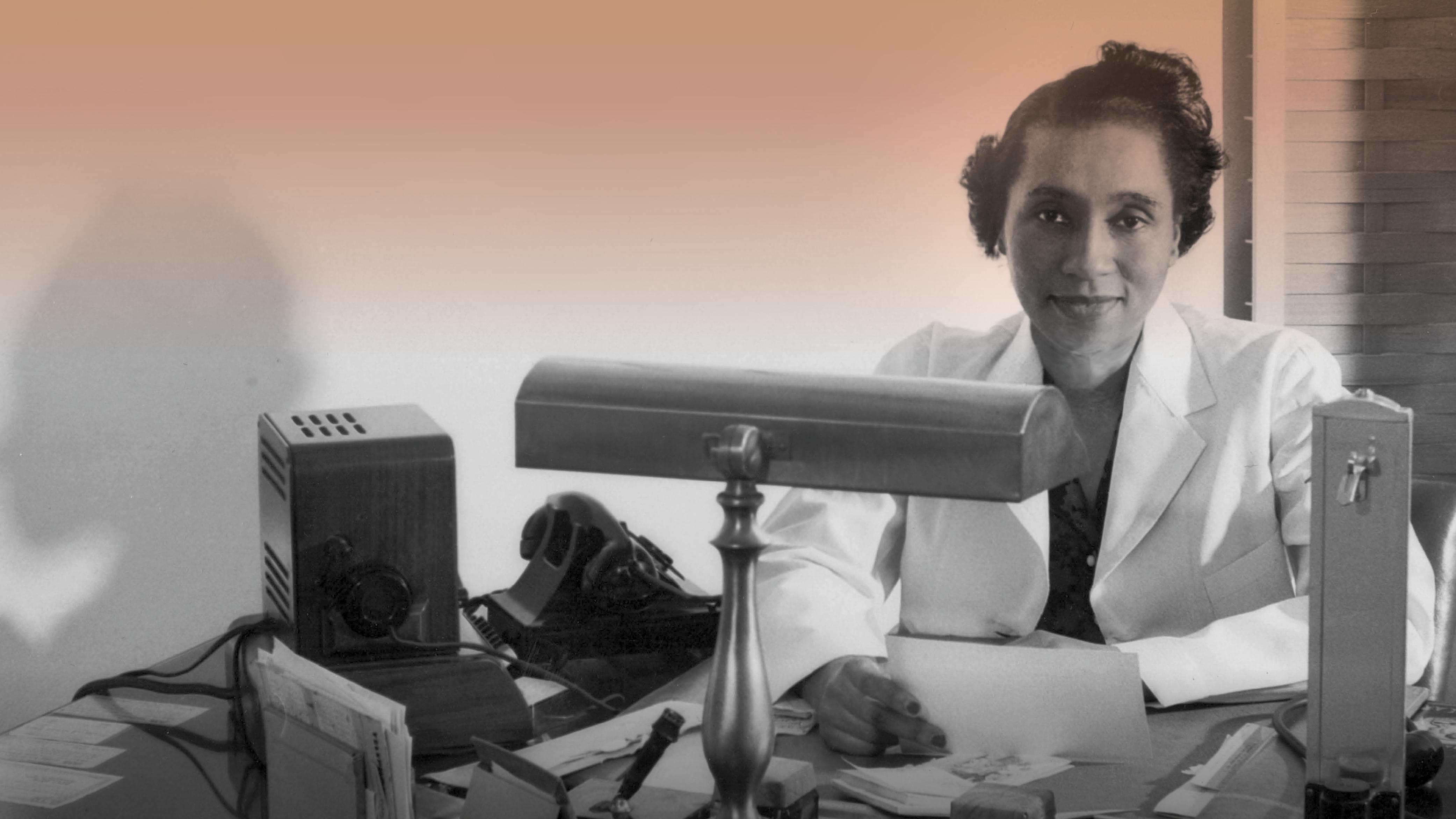 A portrait shows Helen O. Dickens in 1947, wearing a white coat and seated at her desk, with a serene expression.