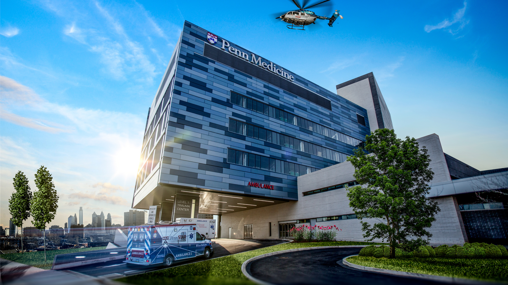 An ambulance and PennStar helicopter arrive at Penn Presbyterian Medical Center's Level 1 Trauma Center