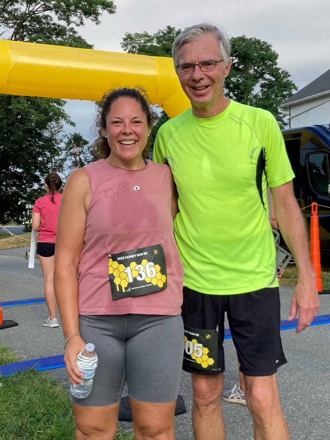 Abbey Oatman and Fred Kohler, sweaty in running gear and smiling