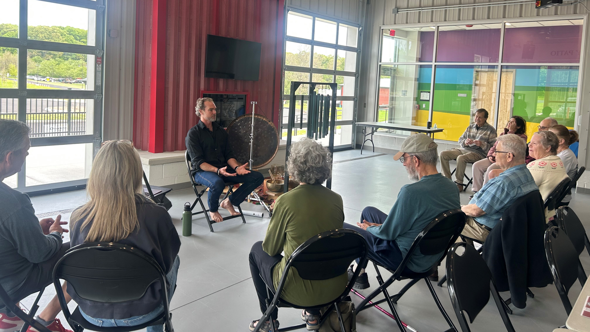 A community event with a speaker and participants.