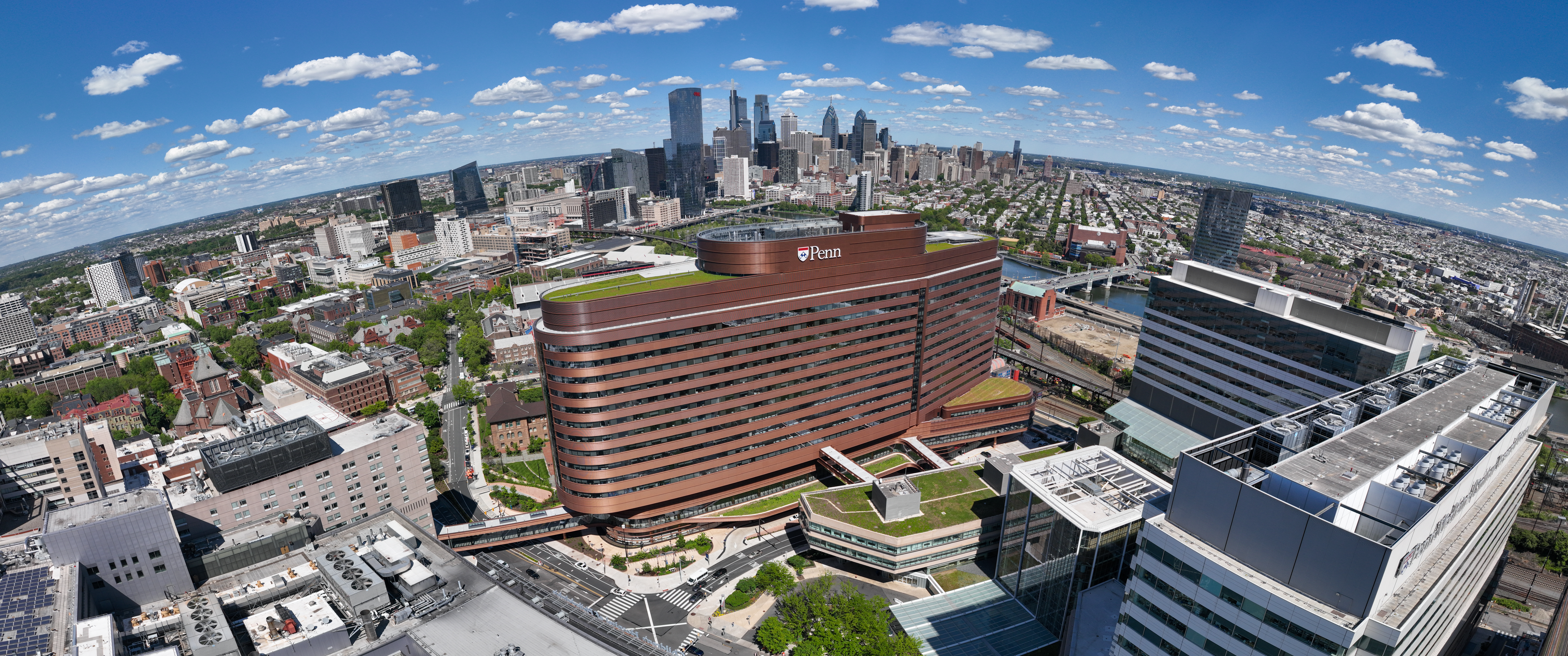 Aerial view of Philadelphia with the Perelman Center and Clifton Center in the foreground and University City and Center City skylines in the background