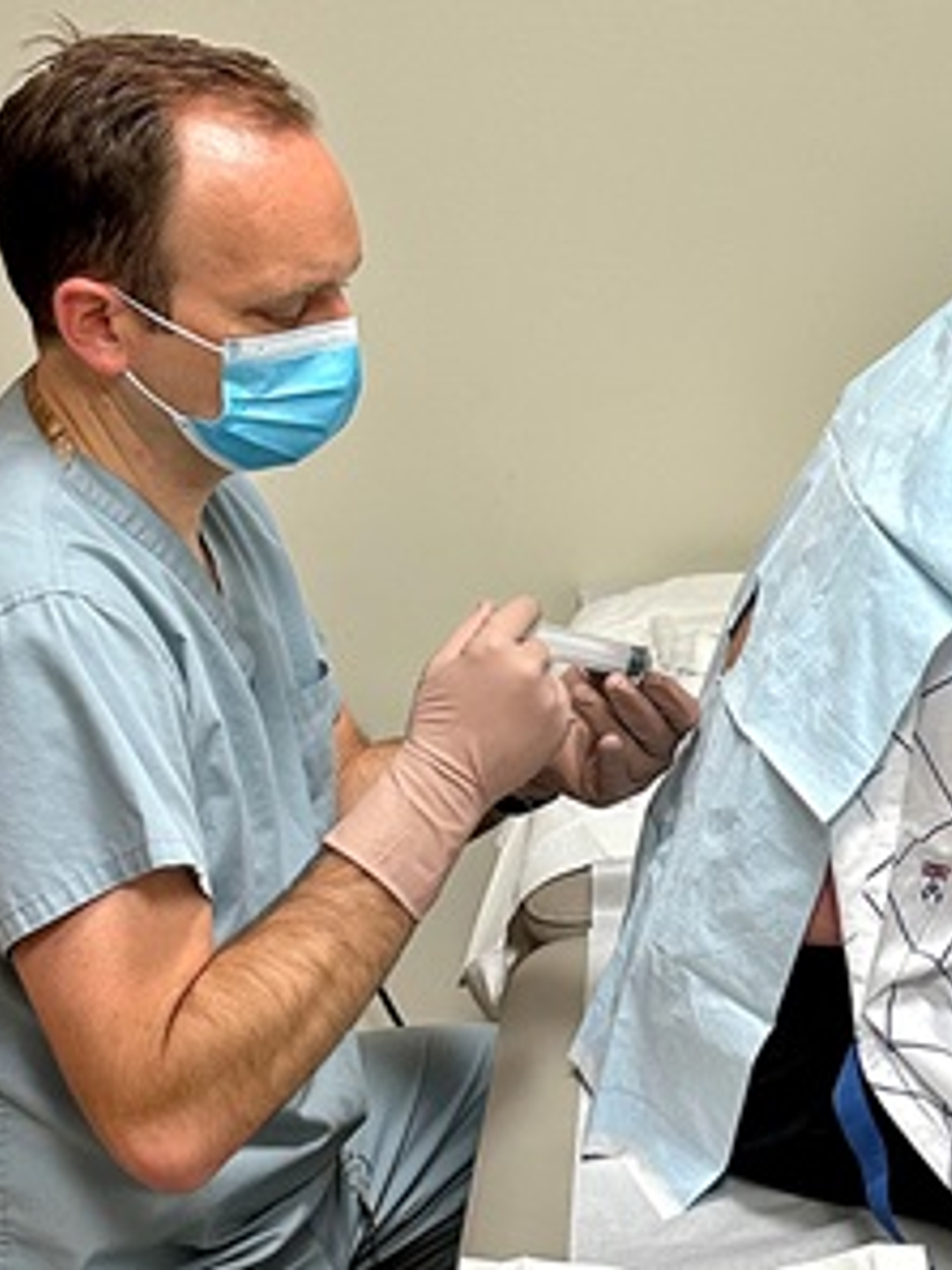 Patient Todd Legg receives his first injection in clinical trial studying the effects of a new ALS drug called Qalsody