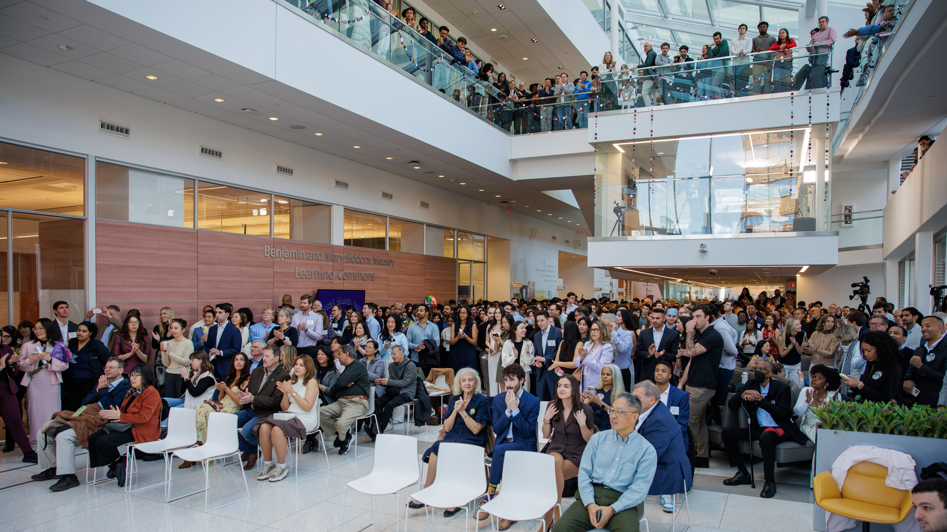 A full atrium looks toward the stage, awaiting the start of Match Day 2026