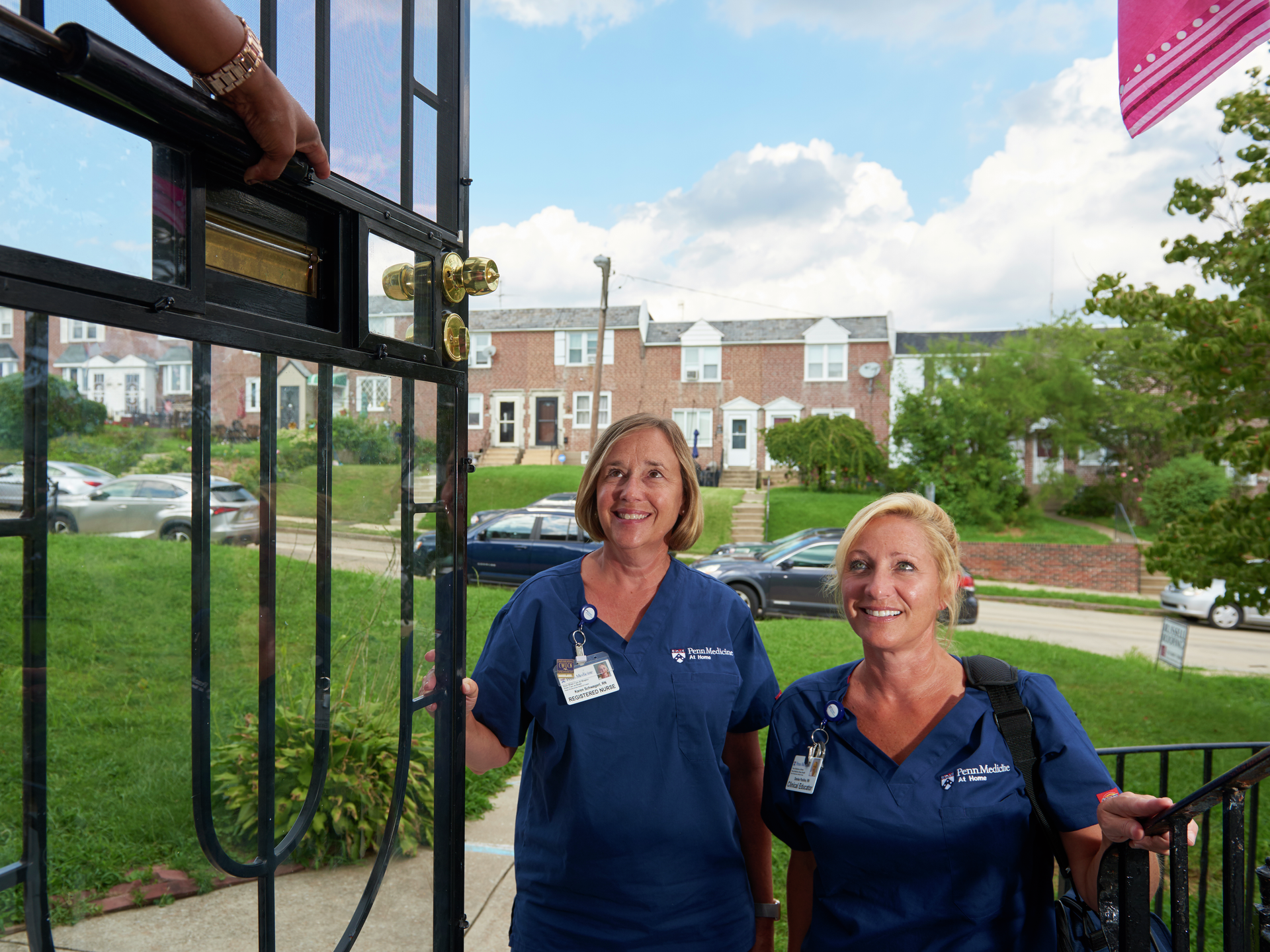 Penn Medicine At Home nurses are greeted by patient at front door of her home