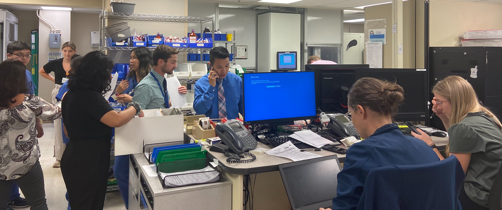Staff work the phones and discuss protocols in Presbyterian Medical Center’s inpatient pharmacy