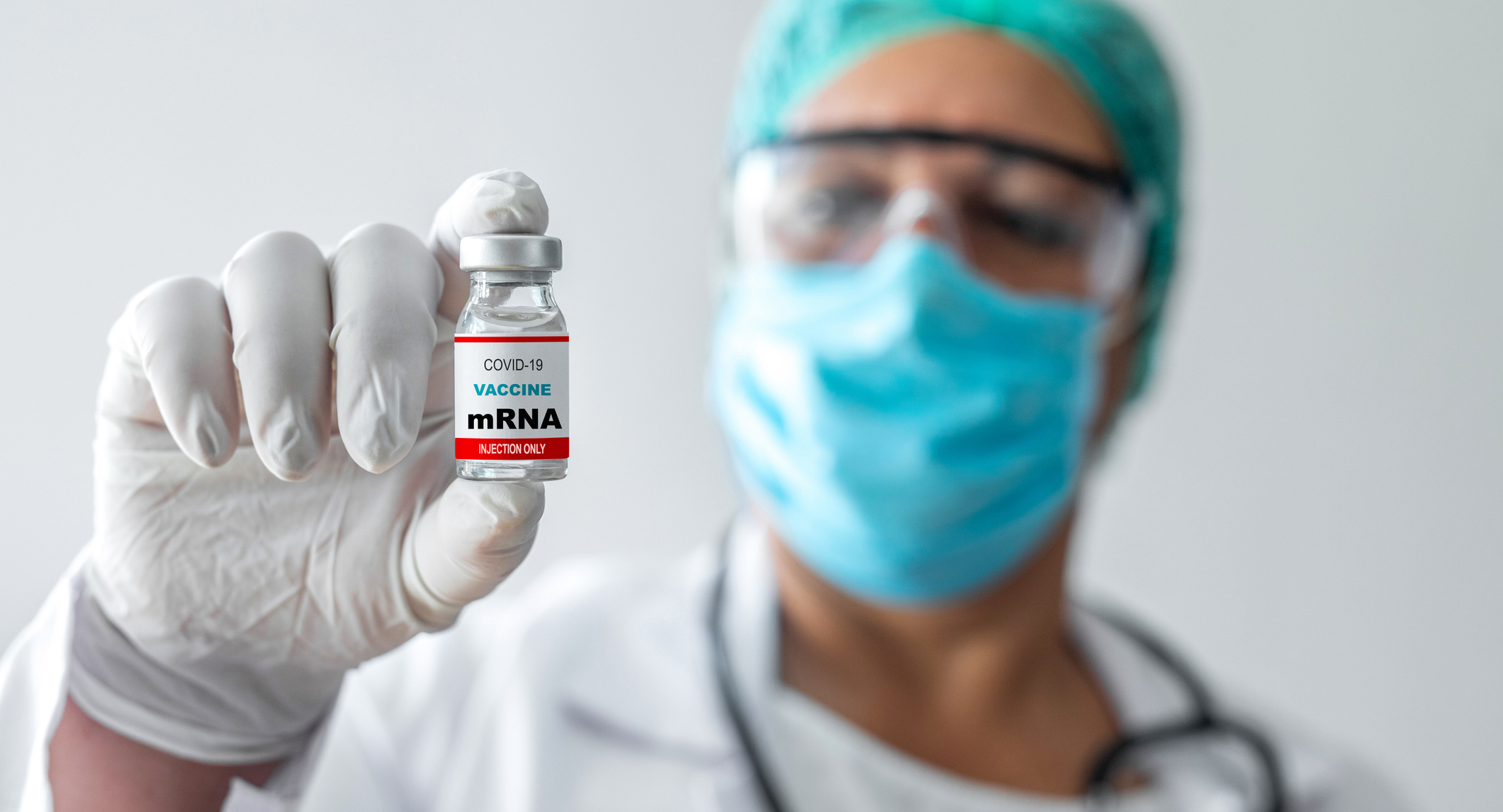 Doctor holding a vial of COVID vaccine