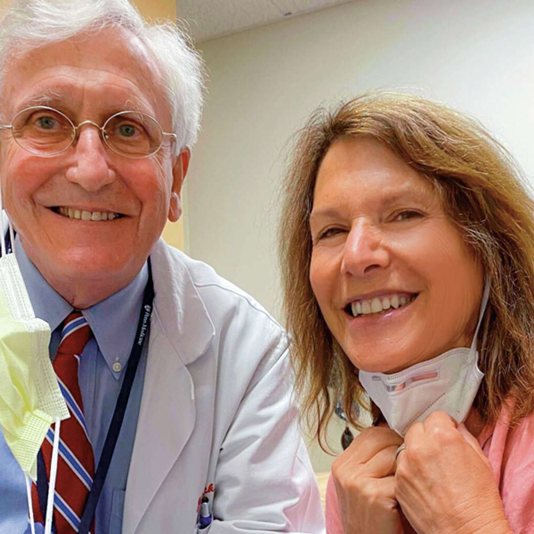 Glick and Lu Ann Cahn smile, pulling down face masks, at her last appointment with him in 2020