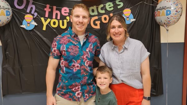 Bri, Phil, and Brayson Iacona at Brayson’s Pre-K graduation ceremony in 2025