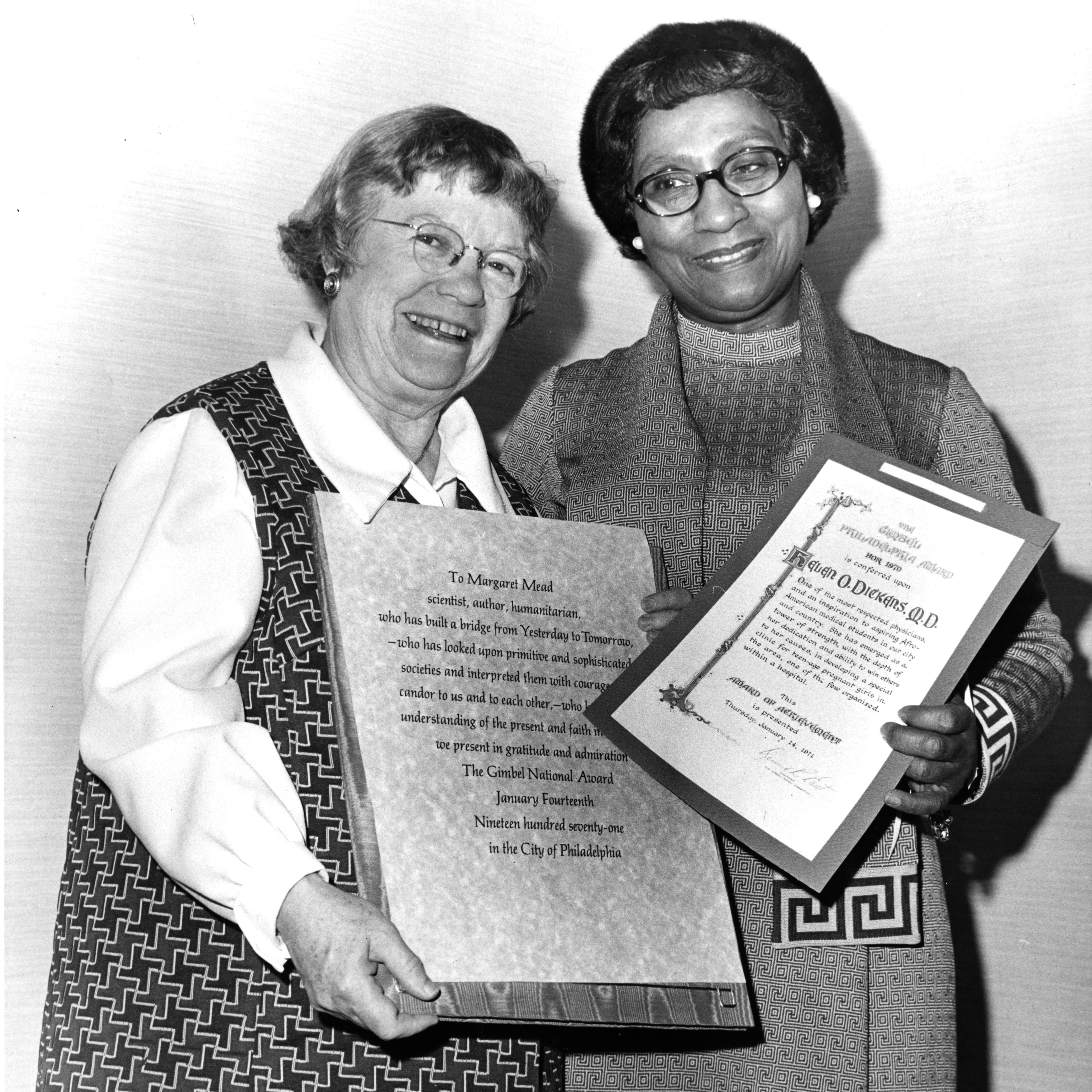 Margaret Mead and Helen O. Dickens stand together for a portrait while holding award certificates.