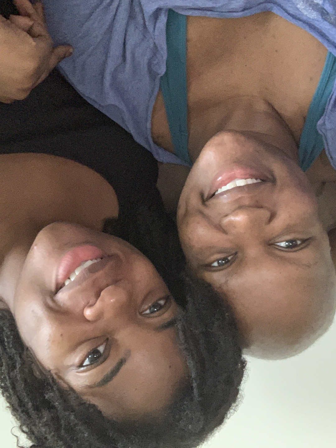 Brooklyn Olumba, on left, sitting next to her twin sister