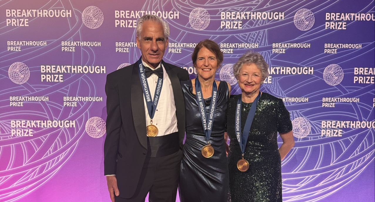 Albert Maguire, Jean Bennett, and Katherine High stand on a red carpet at the 2026 Breakthrough Prize event