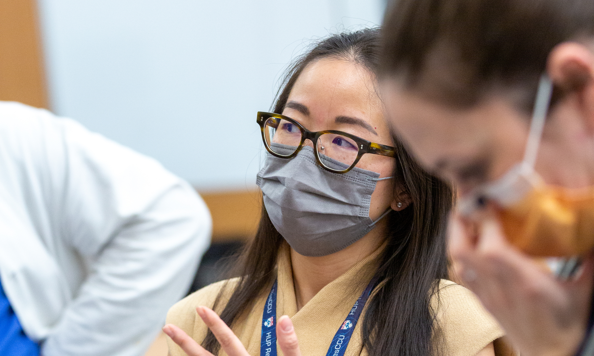 Wilma Chan, MD, wearing a mask, at an ultrasound teaching session