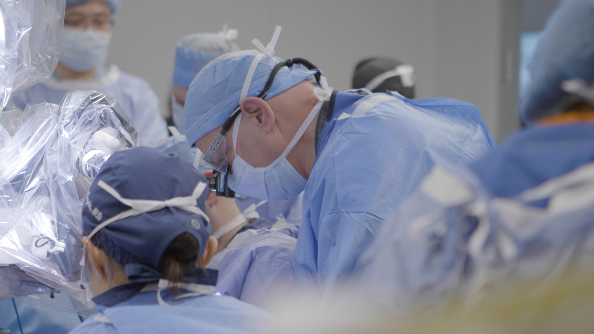 L. Scott Levin and colleagues performing a hand transplant surgery in an operating room