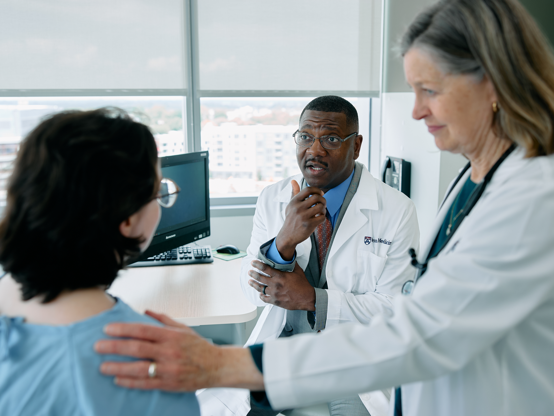 Doctors discussing a stroke care with a patient at a Penn Medicine hospital